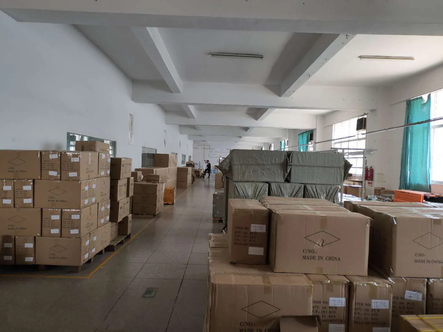 Finished-goods warehouse at PLD with export cartons stacked on pallets