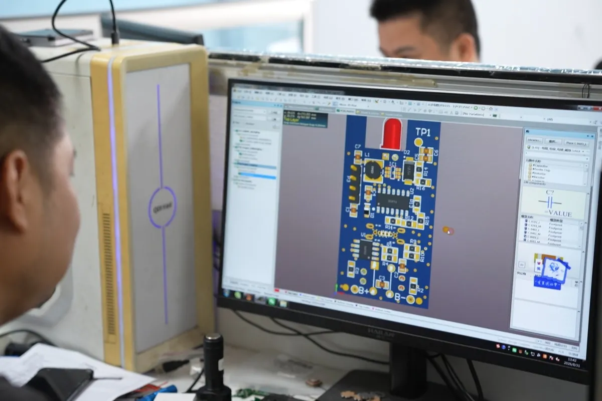 Engineer reviewing a flashlight driver circuit on screen